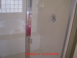 Shower glass door cleaned.