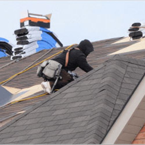 Replacing a roof through insurance claims.