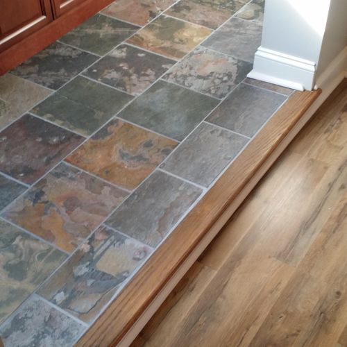 Slate tile and laminate floor.