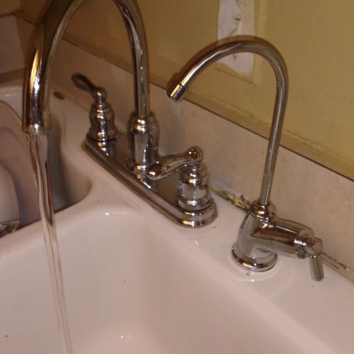 Replacing a kitchen Faucet and a water faucet with