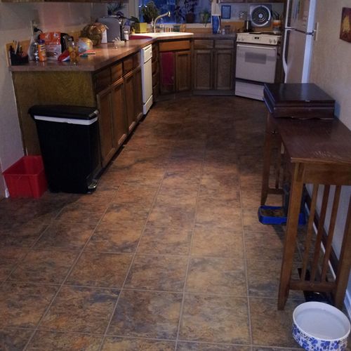 Vinyl floor installed in kitchen.