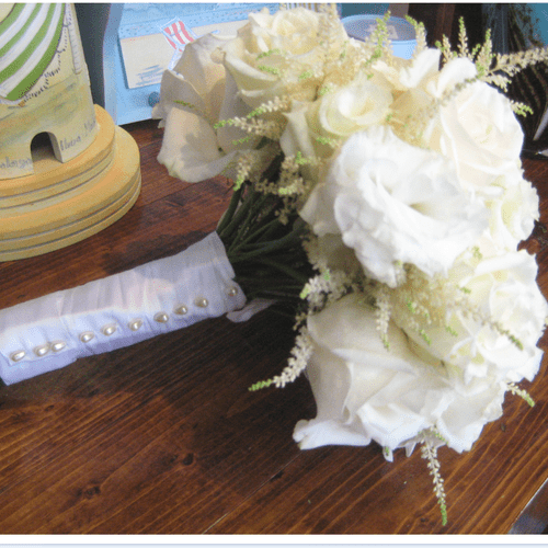 This photo shows the bridal bouquet and the attent