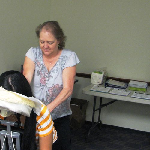 Doing seated (chair) massage for a community outre