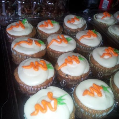 Carrot cake cupcakes with a smooth cream cheese fr