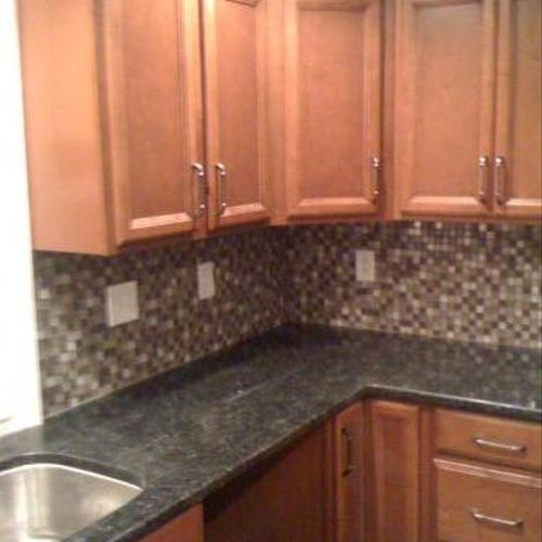 Maple cabinets, granite counter tops, and a glass 