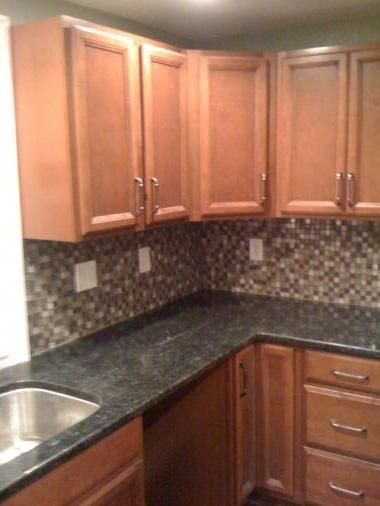 Maple cabinets, granite counter tops, and a glass 