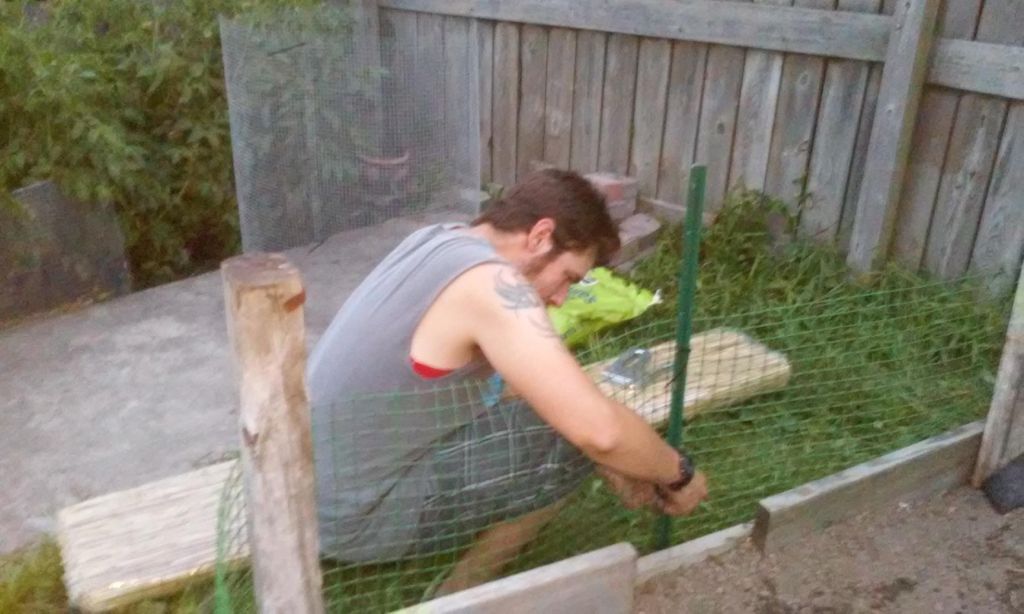Building a raised garden bed for a customer.