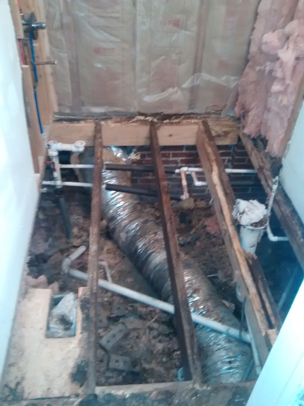 removed damaged flooring and leaking tub