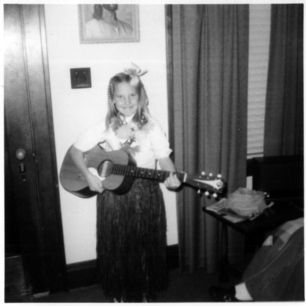 Rita Rae at age 8, with her first guitar.
"My musi