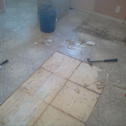 Removing old vinyl flooring...