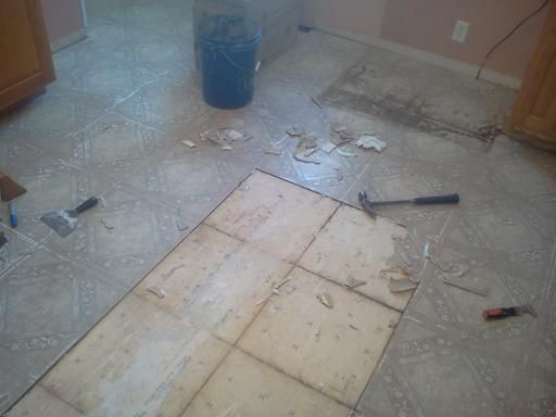 Removing old vinyl flooring...