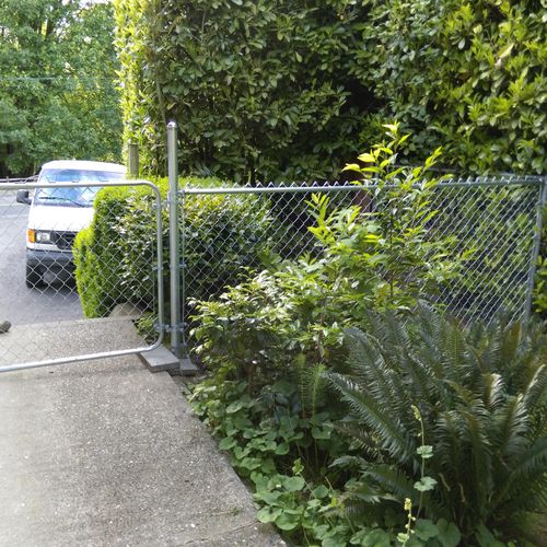 Installation of chain link fence and gate.