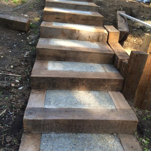 big timber and concrete steps with retaining wall