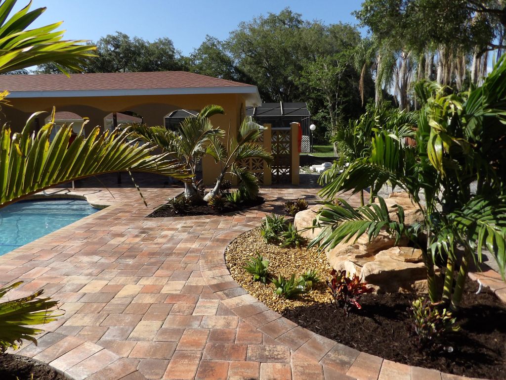 Installed pool paver patios, Waterfall and landsca