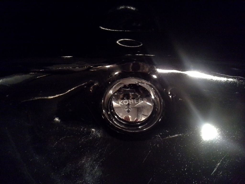 Bringing the drain to to its original shine.