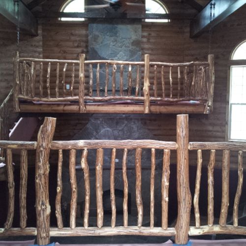 Hand hewn custom railings and spindles! Two story 
