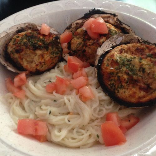 Stuffed Clams over Garlic Pasta with diced tomatoe