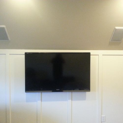 Mounted TV and installed speakers in a Bonus Room