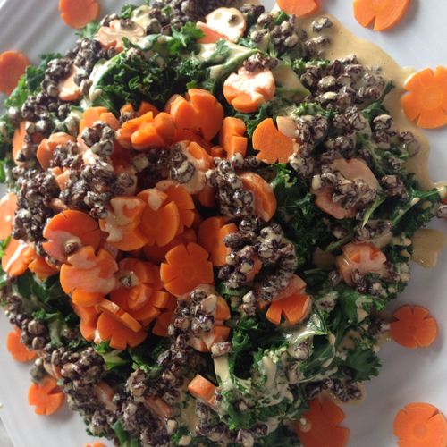 blanched kale salad with carrot flowers and a lemo