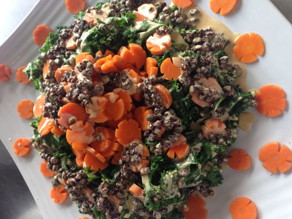 blanched kale salad with carrot flowers and a lemo