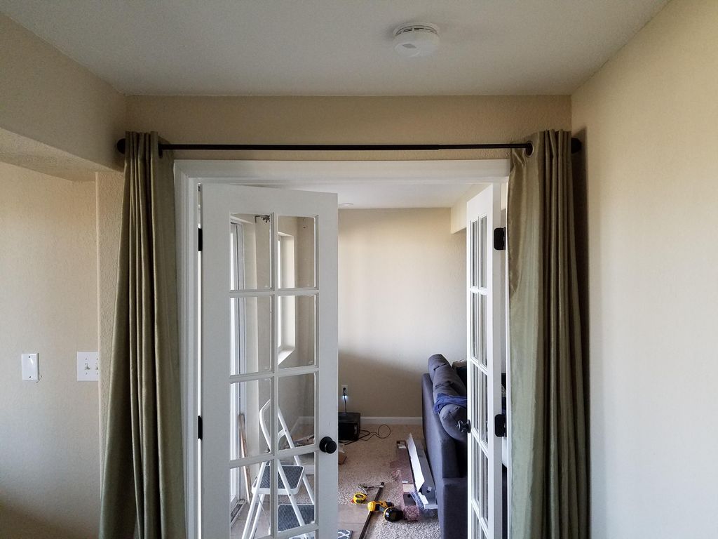 Client curtain rods hung.