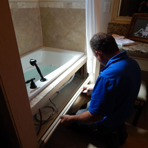 Tim H. visually inspecting whirpool tub for proper