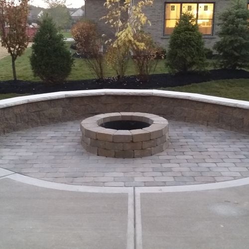 Install a fire pit and seat wall to compliment you