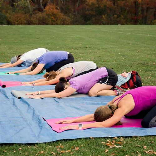 Relaxing with yoga at the end of an outdoor Fit Ca