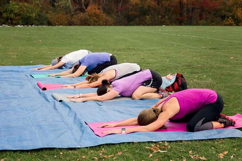 Relaxing with yoga at the end of an outdoor Fit Ca