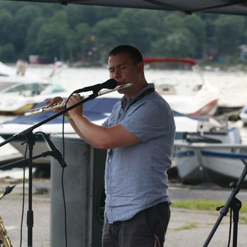 Performing flute at a marina in New Jersey.