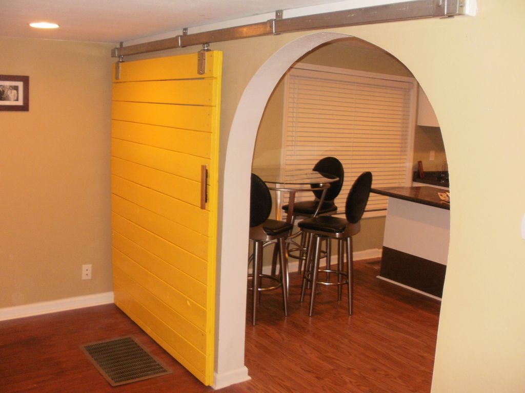 Custom built eclectic barn door using reclaimed 5/