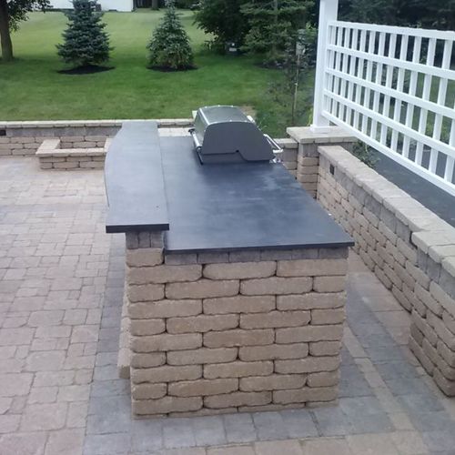 Grill and bar area featuring custom concrete count