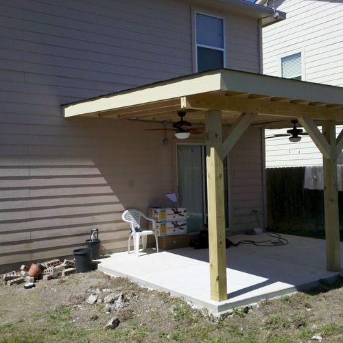 New concrete patio and patio cover roof.