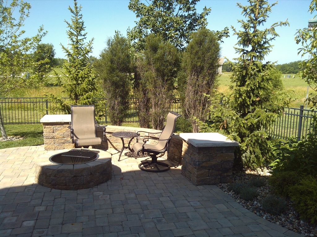 Firepit, seat wall, two tiered patio, and planting