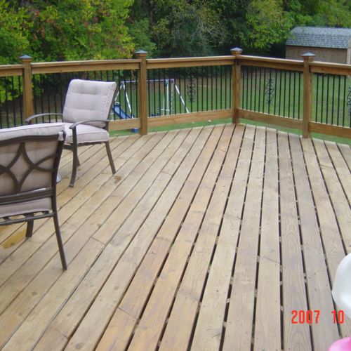 Deck 26ft by 26ft with aluminum railing inserts.