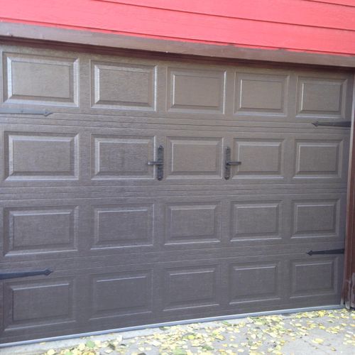 A beautiful brown insulated steel back door with d