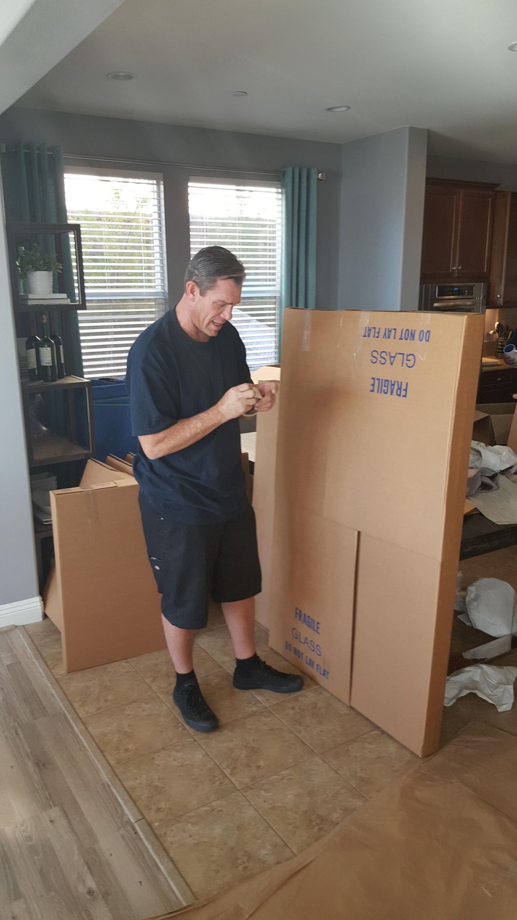 Mike McCracken packing and labeling items