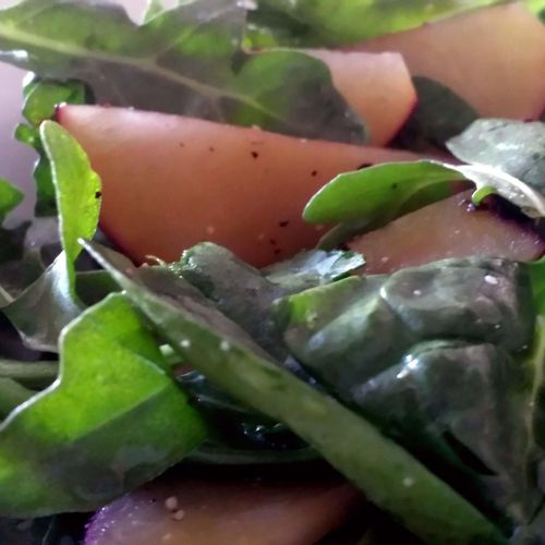 Baby spinach and arugula salad with plums and an o