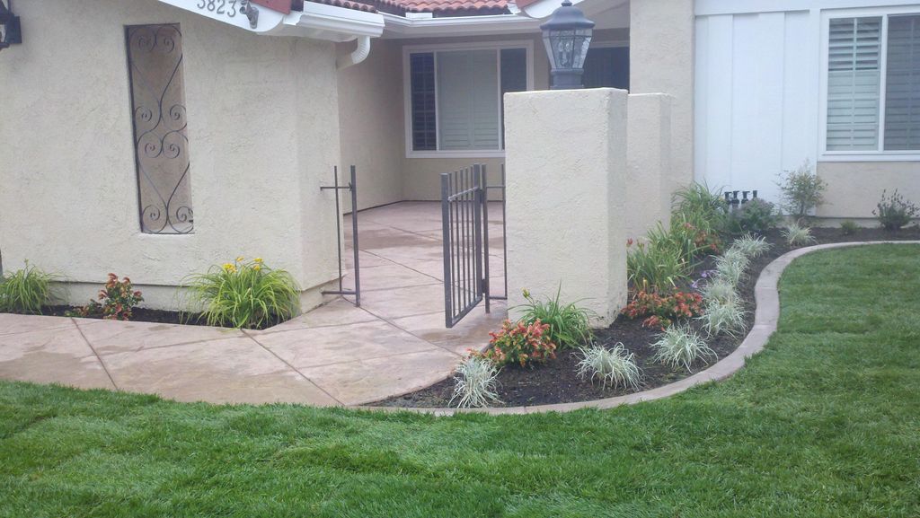 Stamped Colored Concrete, Mow strip, Plants, Sod a