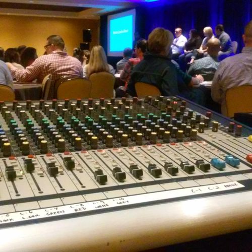 Mixing audio for a small corporate event.