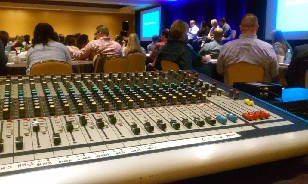 Mixing audio for a small corporate event.