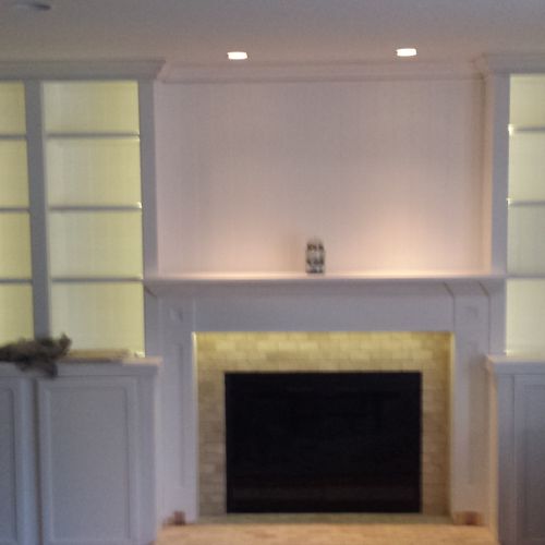 Bookcase and fireplace led lighting.