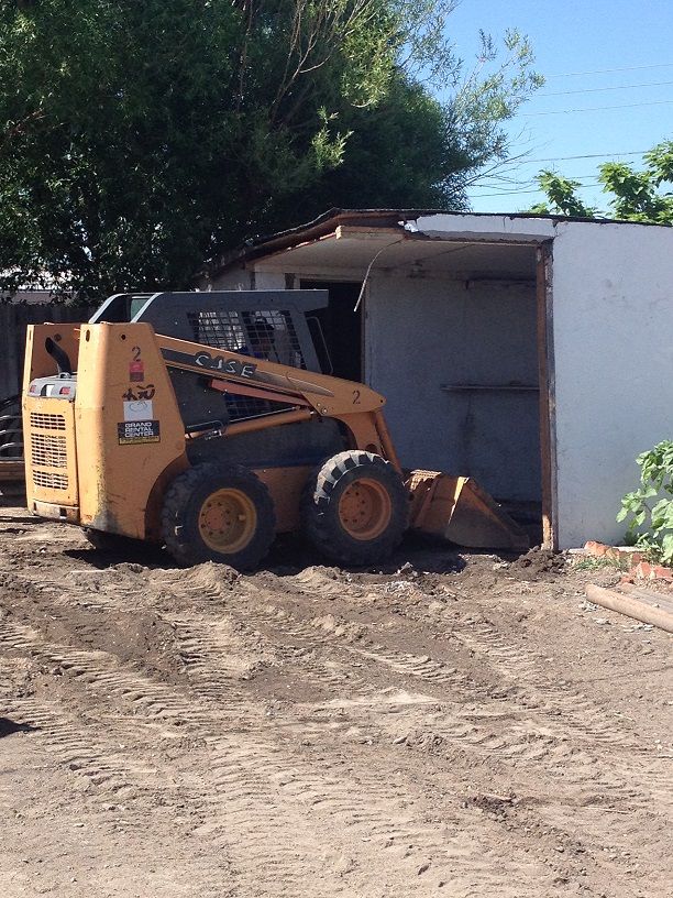Demolition of an old shed to build a garage.