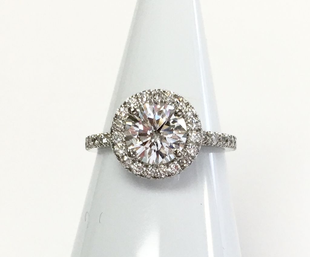 Popular diamond halo engagement ring made for the 