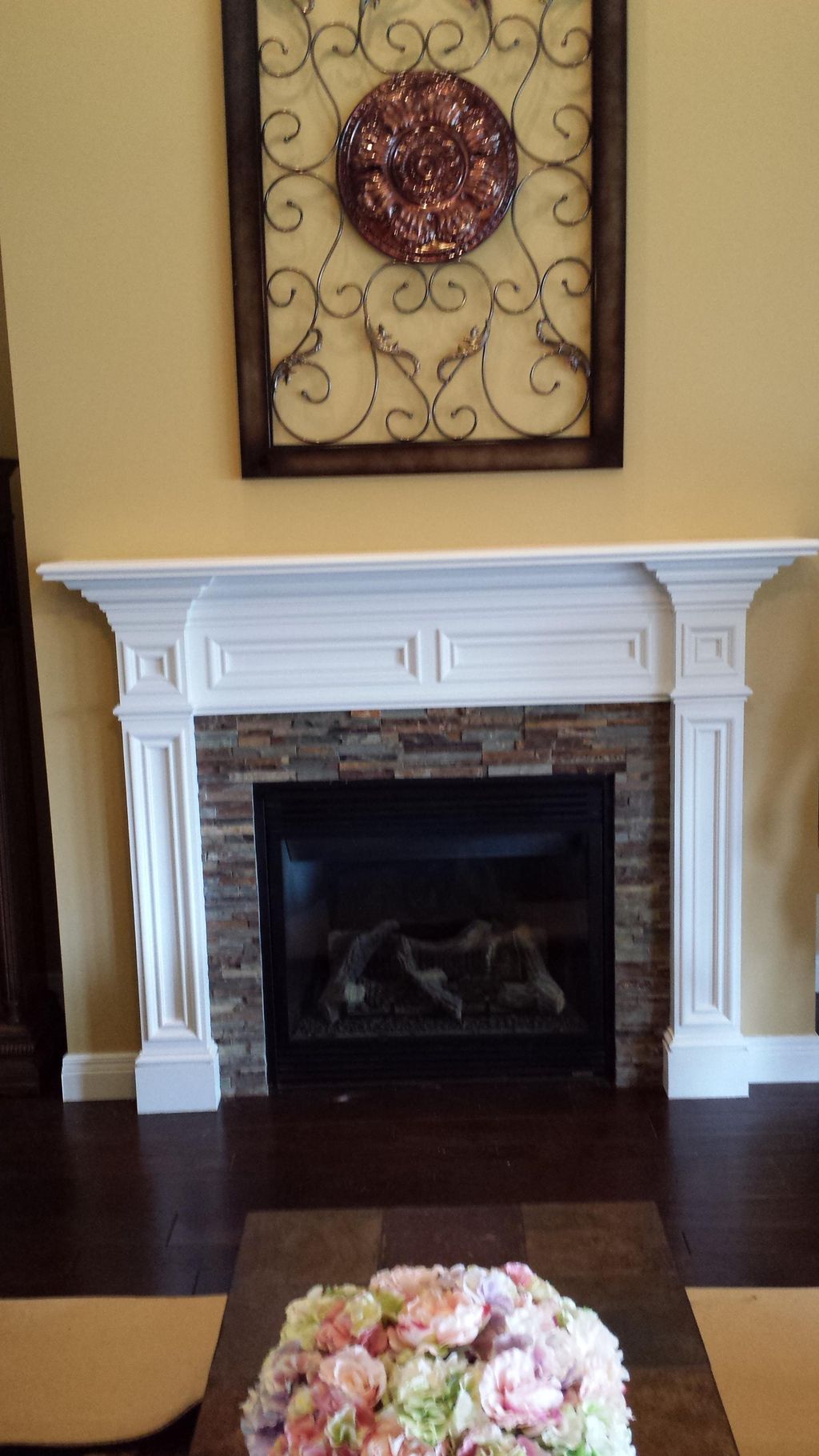 Another custom mantle with slate stone inset.