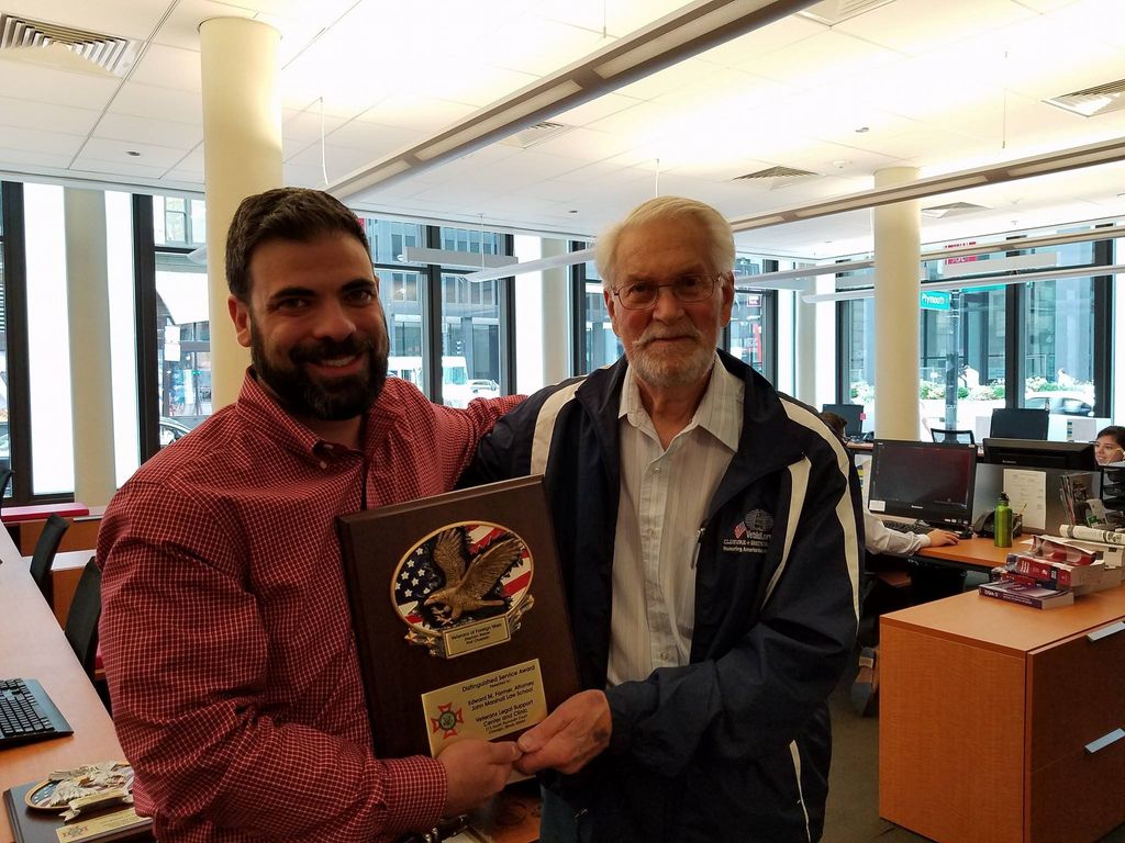 Edward Farmer being awarded a Distinguished Servic