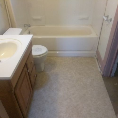 the same bathroom once the floor was repaired.