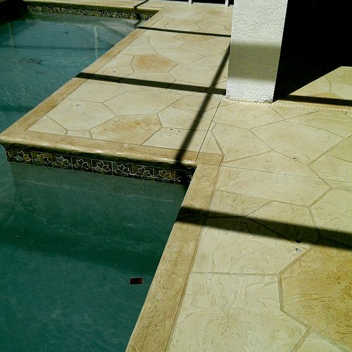 Existing pool deck overalyed with polymere cement 