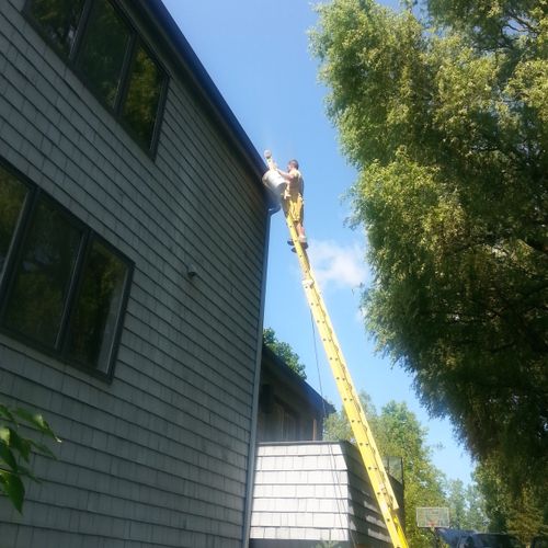 Here I am cleaning gutters on a three story home. 