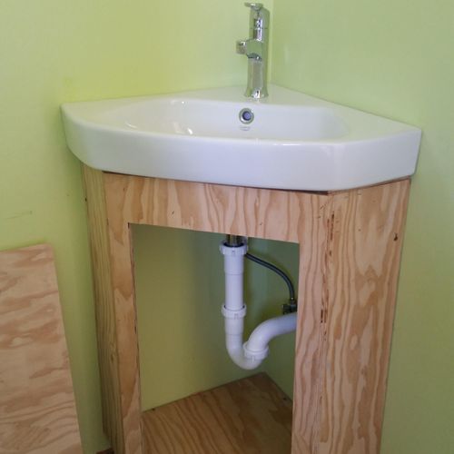 Build a custom cabinet to fit sink.
